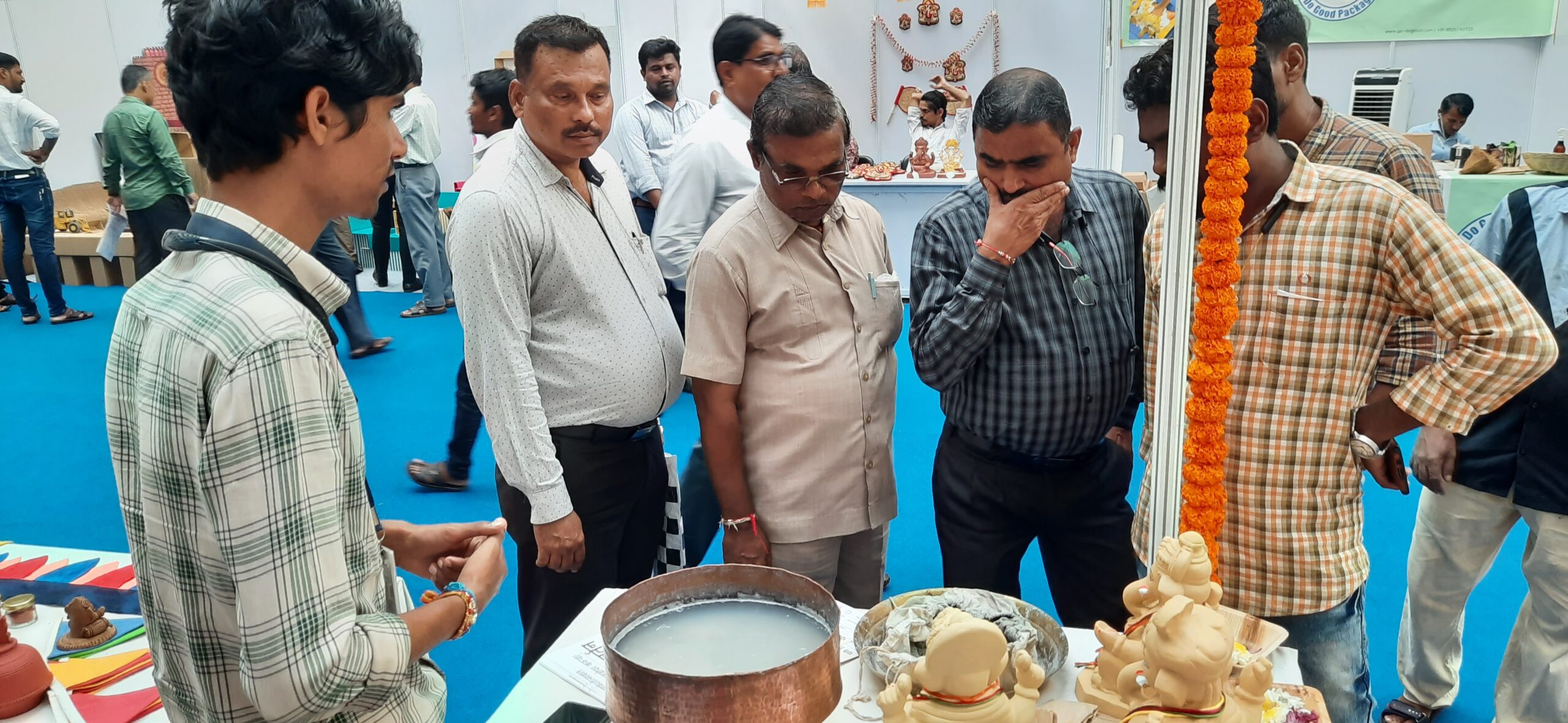 Abhijeet Dodake from Poornam Eco vision explains the process of recycling clay to visitor